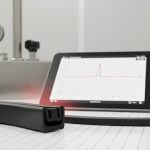 Inflatable seal cross-section with pressure control gauge in a clean lab environment.